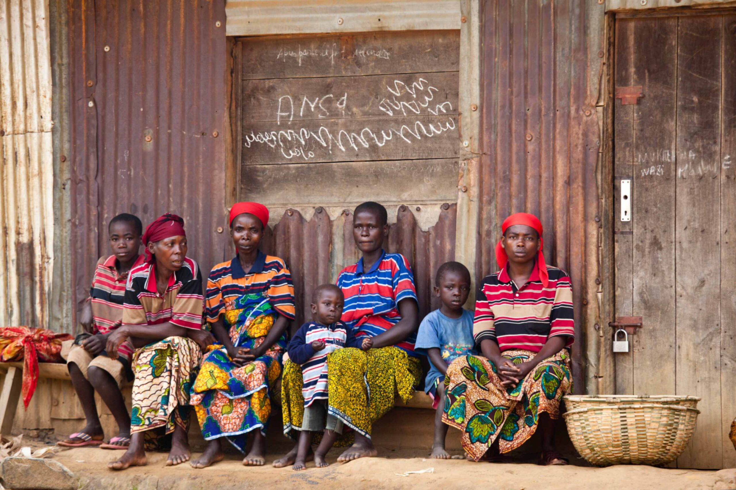 jpeg-optimizer_family-sitting-together-outside-their-home-2024-07-11-03-03-19-utc